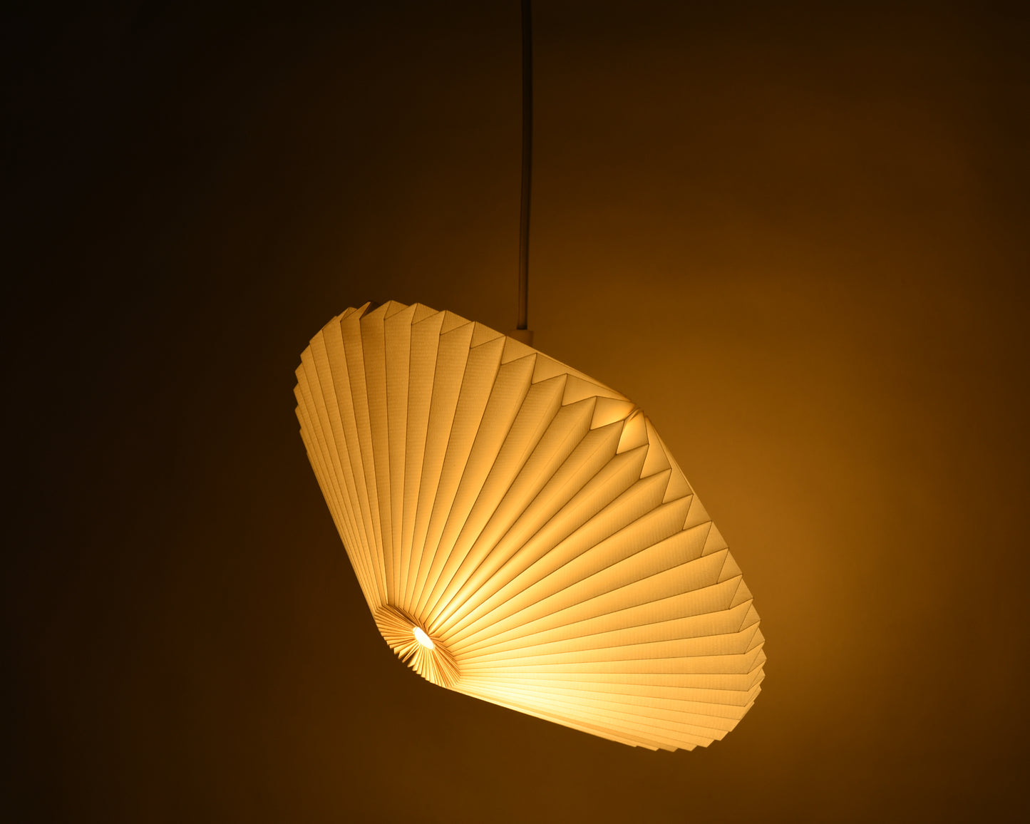 Unfold the magic of light with this origami lamp, a unique addition to your space. (Shop online)